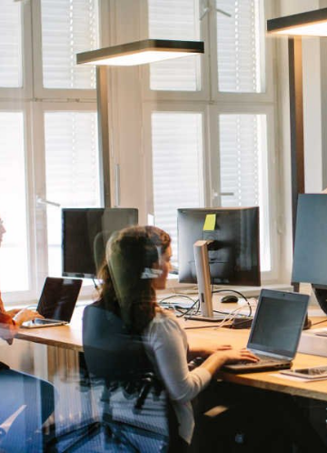 Laptop illustration representing project development and technology solutions